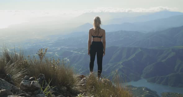 Young Blond Woman Looking At Dramatic Landscape Of La Concha