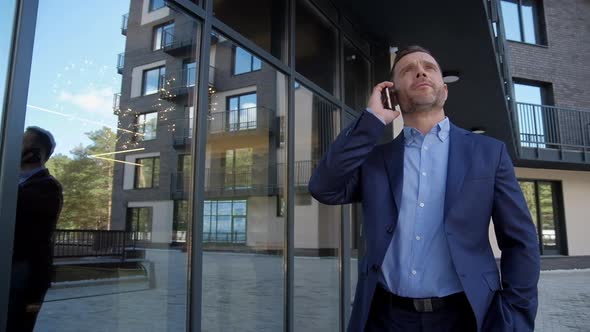 Successful Man Near Business Center Speak at Phone