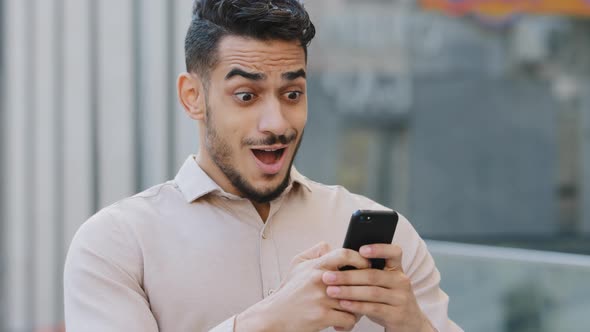 Hispanic Amazed Businessman Receiving Sms Message Offer Opportunity Arabian Happy Man Reading Good