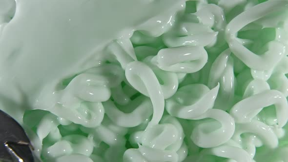 Motion of the Liquid Cream Green Cosmetic Texture with Rotation