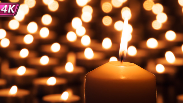 Candle And Small Lights In The Background