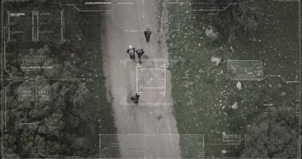 Surveillance drone camera view of terrorist squad walking with weapons