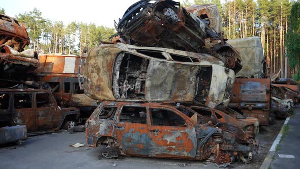 Car Dump with Burnt Down Destroyed Civil Automobiles in Ukraine