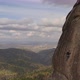A Young Man Climbs To the Top of a Mountain on a Vertical Wall with a Great View of the Valley - VideoHive Item for Sale