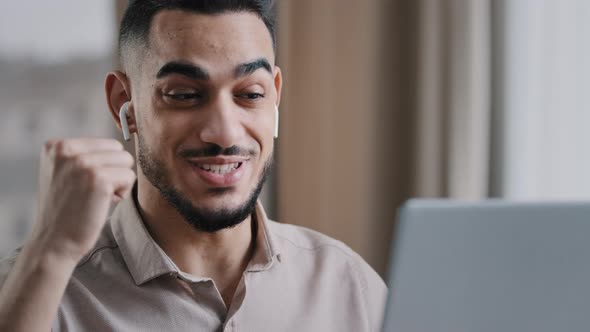 Arab Guy Male Hispanic Teacher in Internet Wears Wireless Earphones Talk at Webcam Computer Video