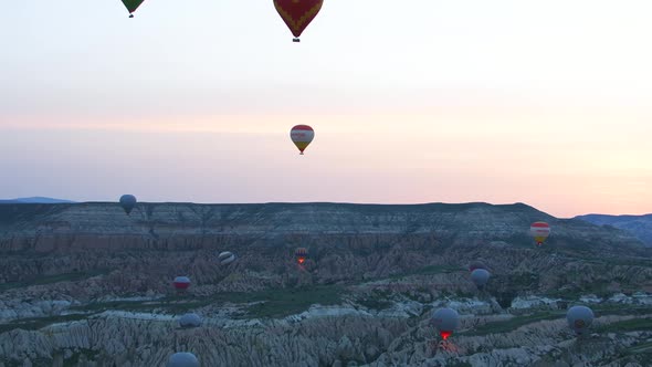 Multi-colored Air balloons flies in sky over Cappadocia, Turkey