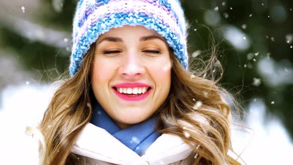 Portrait of Happy Smiling Woman Outdoors in Winter