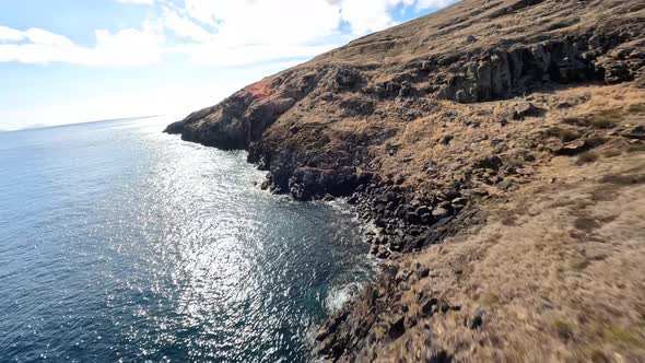 FPV Racing Drone Mountain Surfing and Cliff Diving Along the Rocks