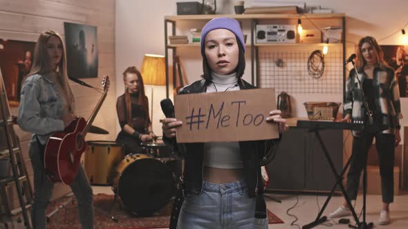 Female Rock Singer Holding MeToo Sign