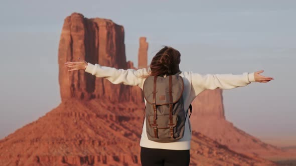 Happy Woman Enjoying Cinematic Monument Valley at Sunset Slow Motion  Footage