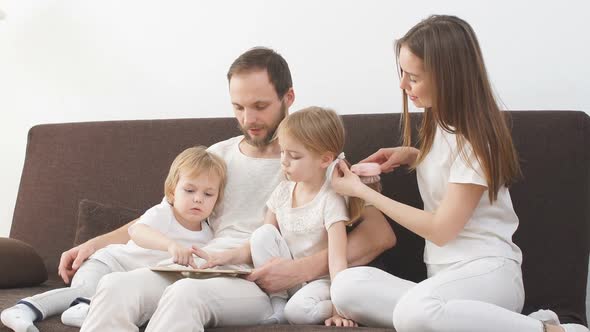 Young Family Spend Time Together at Home.