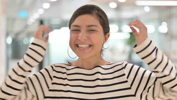 Portrait of Excited Indian Woman Celebrating Success