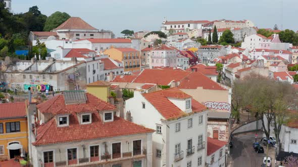 Low Aerial Dolly in Aerial View of Colorful Traditional Houses and Homes with Red Rooftops in