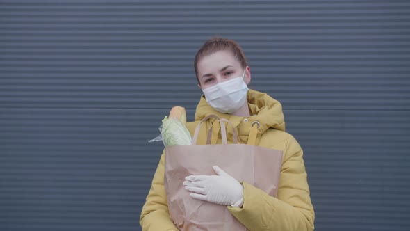 Young Woman with Purchases From the Supermarket