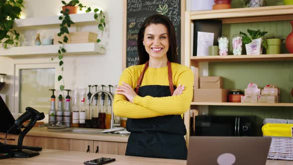 In Front of the Camera Posing Barista Woman with a