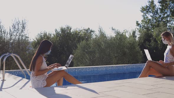 Women Using Laptop Work Remotely on Social Distance Wearing Face Masks