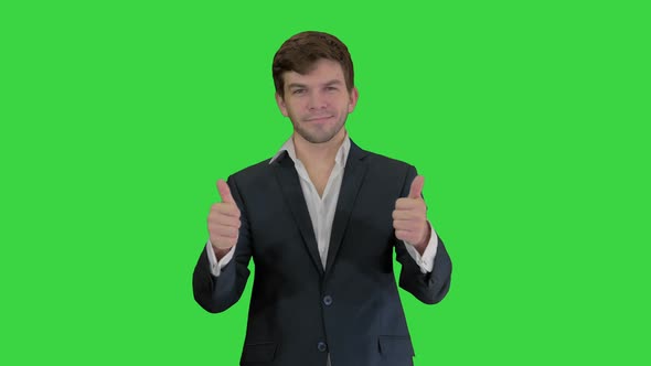 Young Business Man Going Thumbs Up and Ok Gesture After on a Green Screen, Chroma Key.