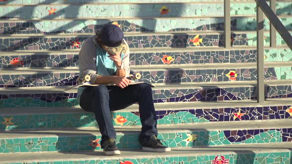 Portrait of a young man skateboarding