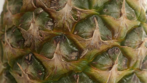 Texture of Ananas comosus slow tilt 4K 2160p 30fps UltraHD  footage - Detailed pineapple fruit surfa