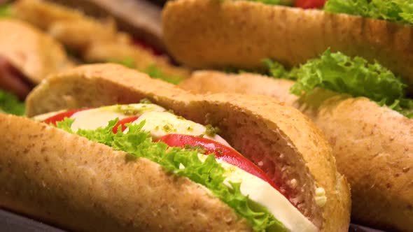 Closeup on Sub Sandwiches on Display on a Counter in a Store