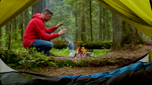 Bearded Man By the Fire in a Beautiful Forest