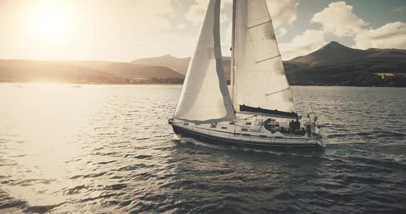 Aerial Slow Motion of Yacht Regatta Sailing at Sun Reflection on Ocean Coast