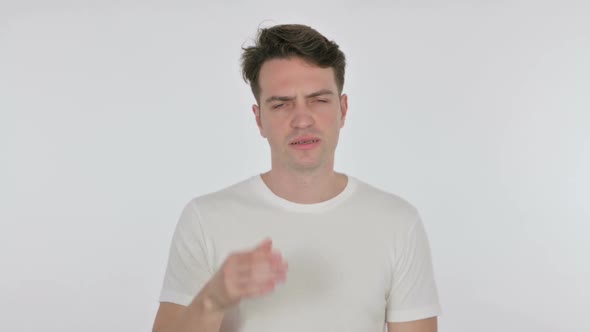 Young Man with Headache on White Background