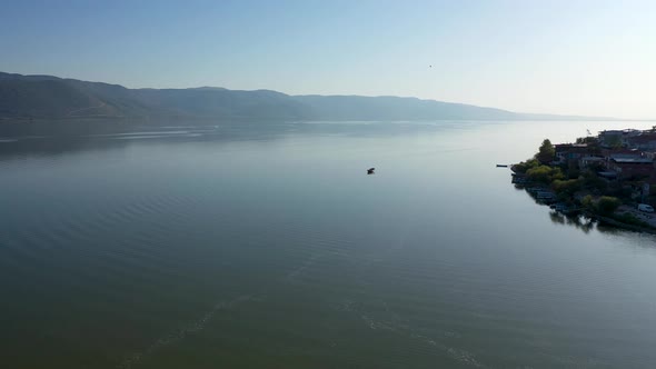 Fishing boat on lake at sunset golyazi, bursa turkey