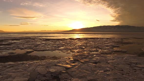 Flying over ice chunks on shoreline of frozen Utah Lake