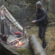 Adventurer Chopping Wood With Axe by the Campfire and Vintage Tent - VideoHive Item for Sale
