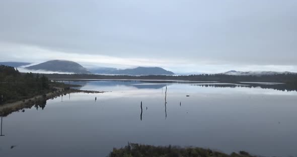 Kumara Reservoir on New Zealand's South Island West Coast Epic cinematic aerial on a calm and eerie