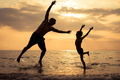 Father and son playing on the beach at the sunset time. - PhotoDune Item for Sale