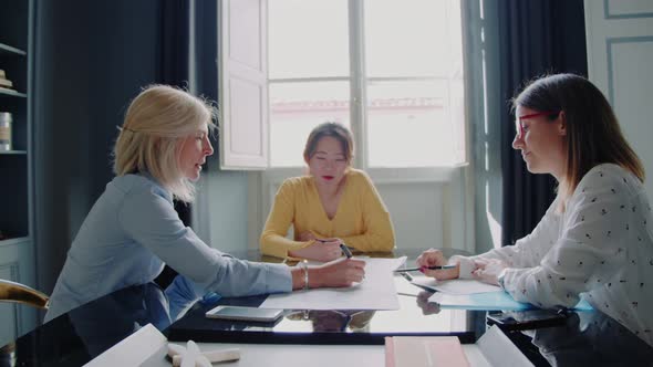 Three businesswomen having a meeting in the office