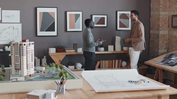 Men Talking in Architectural Bureau