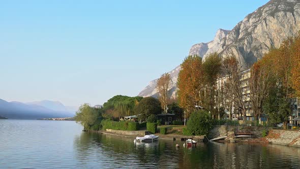 Seagull Flying Over the Lake Against the Mountain Landscape Background on Sunny Day