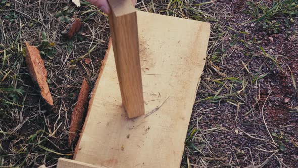 Preparing Firewood for Lighting a Fire Outside