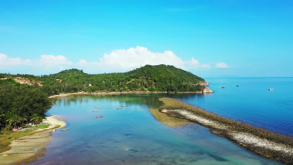 Beautiful above copy space shot of a white sand paradise beach and blue sea background in colourful 