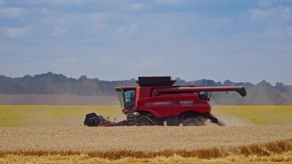 Agricultural Machine Working on the Field. 