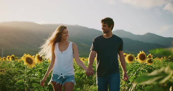 Happy couple in sunflower fields