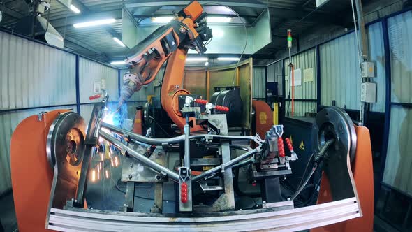 Bicycle Frame Being Welded Via Modern Automated Machine