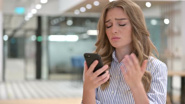 Portrait of Businesswoman Having Loss on Smartphone 