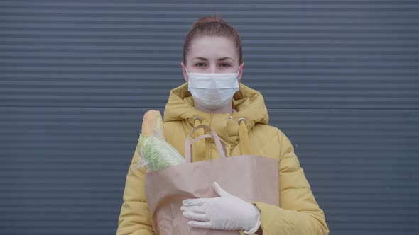 Young Woman with Purchases From the Supermarket