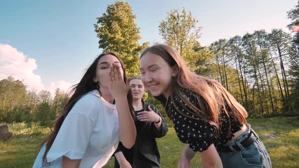 Girls Blow a Kiss and Dance at a Picnic Near the Forest