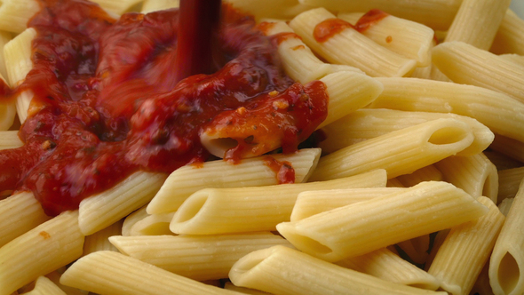 Steaming Hot Tomato Sauce Pours On Pasta