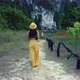 Cute Smiling Asian Girl Walking on a Trail in Cheow Lan Lake Thailand - VideoHive Item for Sale