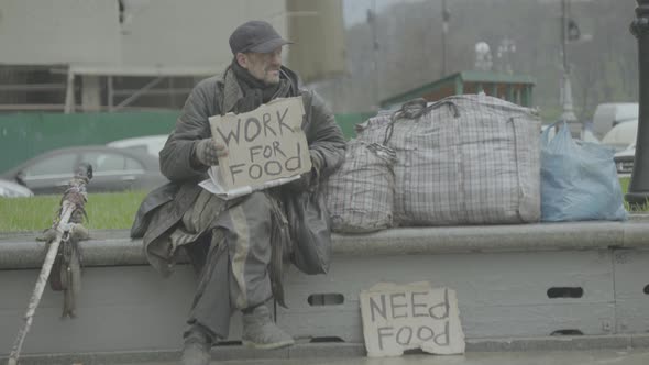 The Inscription "Work for Food" By the Poor Homeless Tramp. Kyiv. Ukraine