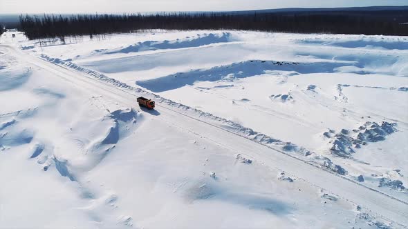 Aerial View of Truck Driving on Contryside Road Working in Gas Factory.