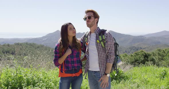 Young Couple Laughing While Hiking