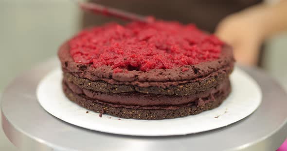 Spreading Raspberry Jam on a Cake