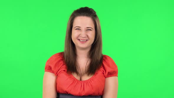 Portrait of Cute Girl Bursting with Laughter Being in Positive. Green Screen